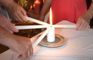 Image of candle lighting as part of a renewal of marriage vows service