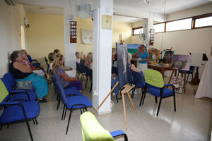 An image of the Women's Group enjoying a meeting