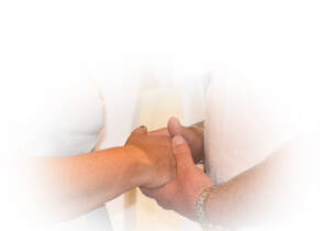 Image of clasped hands during renewal of vows service